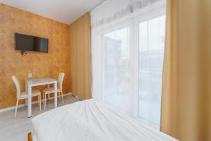 Posteľ alebo postele v izbe v ubytovaní APT Nadmorskie - Spokojne