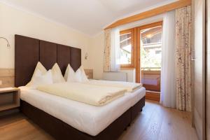 Łóżko lub łóżka w pokoju w obiekcie Appartement Schöne Aussicht