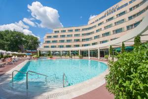 a large swimming pool in front of a hotel at Jeravi Beach Hotel - All Inclusive in Sunny Beach