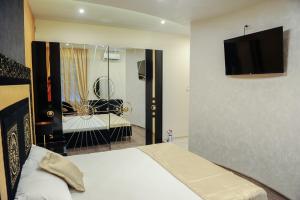 TV a/nebo společenská místnost v ubytování Apartmani President V