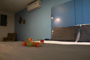 Кровать или кровати в номере Hotel - Résidence Habitation Grande Anse
