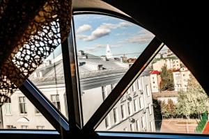 a view of a city from a window at Азалия на Московской in Kazan