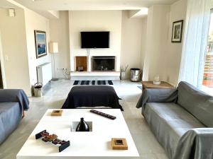 A seating area at Legrena Beach Villa