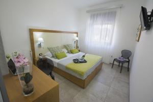 a hotel room with a bed and a table at Best Western Hotel Martello in Lampedusa