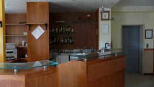 a kitchen with a sink and a counter top at Albergo Le Piante in Manerba del Garda