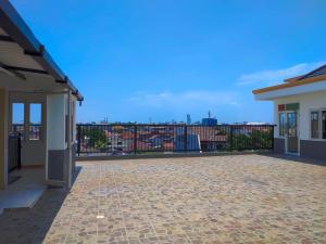a balcony with a view of a city at La Tana Hotel in Bagongsabrangan