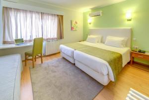 Postel nebo postele na pokoji v ubytování Hotel D. Dinis
