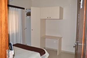 Łóżko lub łóżka w pokoju w obiekcie Ponta View Hotel