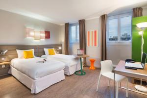 Voodi või voodid majutusasutuse Matabi Hotel Toulouse Gare by HappyCulture toas