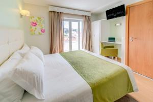 Postel nebo postele na pokoji v ubytování Hotel D. Dinis
