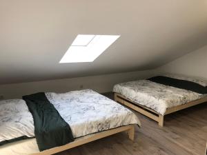 Postel nebo postele na pokoji v ubytování Apartament Telkom 1