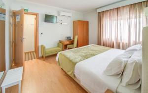 Postel nebo postele na pokoji v ubytování Hotel D. Dinis