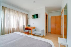 Postel nebo postele na pokoji v ubytování Hotel D. Dinis