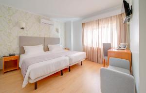 Postel nebo postele na pokoji v ubytování Hotel D. Dinis