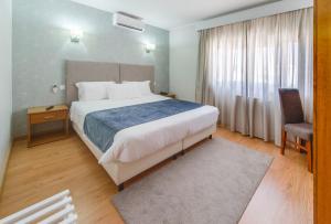 Postel nebo postele na pokoji v ubytování Hotel D. Dinis