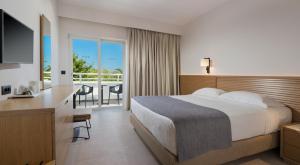 Postel nebo postele na pokoji v ubytování Platanista Hotel