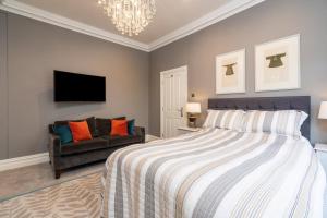 Postel nebo postele na pokoji v ubytování Wellington Square - By Luxury Apartments