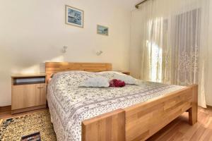 Postel nebo postele na pokoji v ubytování Apartments ZANA (77)