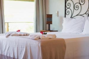 Cama ou camas em um quarto em Pousada Amanhecer