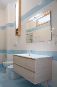 Ένα μπάνιο στο Oasi Smart Rooms