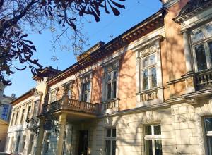 a building with balconies on the side of it at Linat Orchim Dom Gościnny in Łódź
