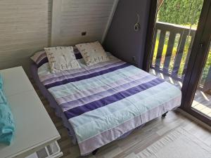 Ένα ή περισσότερα κρεβάτια σε δωμάτιο στο Holiday Home Magnolia