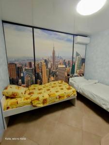 a bedroom with a view of the city at Mini-otel on Harkivske shose in Kyiv