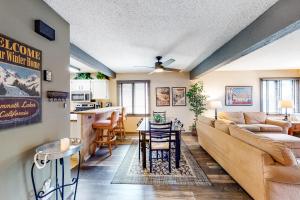 a living room with a couch and a table at Sunrise 8 in Mammoth Lakes