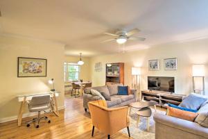 a living room with a couch and a piano at Mid-Century Bozeman Townhome about 1 Mi to Dtwn! in Bozeman