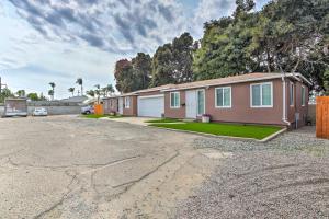 a house in a parking lot with a driveway at Chula Vista Retreat about 1 Mi to Third Avenue Village in Chula Vista