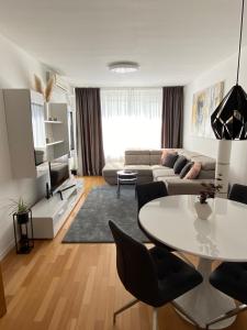 a living room with a couch and a table at Apartment Queen in Zagreb
