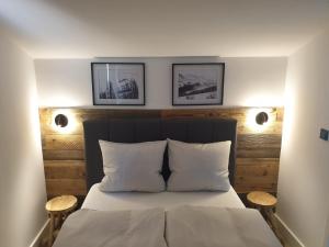 Postel nebo postele na pokoji v ubytování WALDVILLA Bad Kleinkirchheim