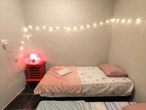 Giường trong phòng chung tại Hospedaria Studio 373 - Vila Mariana - Valores Acessíveis