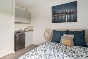 Ένα ή περισσότερα κρεβάτια σε δωμάτιο στο Studio Tranquille et COSY Fonderie