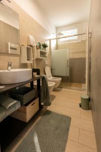 a bathroom with a sink and a toilet at Agriturismo Cascina Costa in Cassago Brianza