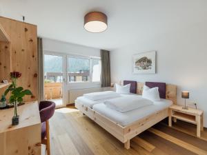 Postel nebo postele na pokoji v ubytování Hotel Krüzli - dapi 1914
