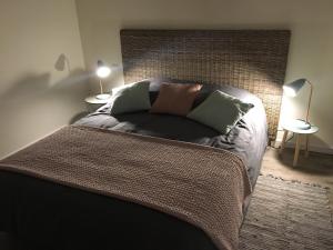En eller flere senge i et værelse på Les Gîtes du Lachat