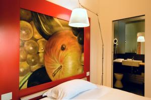 Postel nebo postele na pokoji v ubytování Petronilla - Hotel In Bergamo