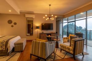 TV a/nebo společenská místnost v ubytování CLEO LAKE KIVU HOTEL