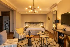 Postel nebo postele na pokoji v ubytování CLEO LAKE KIVU HOTEL + 28 fotografií