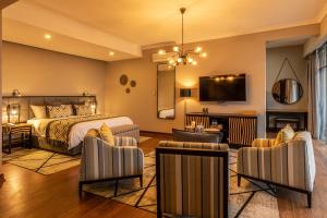 TV a/nebo společenská místnost v ubytování CLEO LAKE KIVU HOTEL