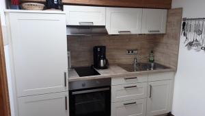 Kuchyň nebo kuchyňský kout v ubytování Alpchalet - Ferienwohnung Loy