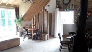 a dining room with a table and chairs at Ma baraque de vacances in Butgenbach +25 photos