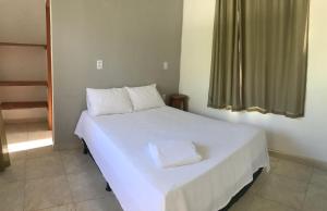 Кровать или кровати в номере Casa de pescador