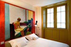 Postel nebo postele na pokoji v ubytování Petronilla - Hotel In Bergamo