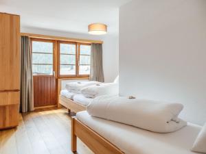 Postel nebo postele na pokoji v ubytování Hotel Krüzli - dapi 1914