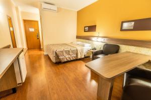 Postel nebo postele na pokoji v ubytování Hotel 10 Blumenau