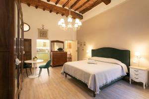 Кровать или кровати в номере Casa Mavì- Siena