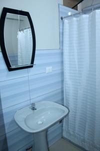 Ett badrum på Zentrico Hotel
