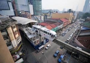 a view of a city with a bus on a street at Hotel Sentral Kuala Lumpur at KL Sentral Station in Kuala Lumpur